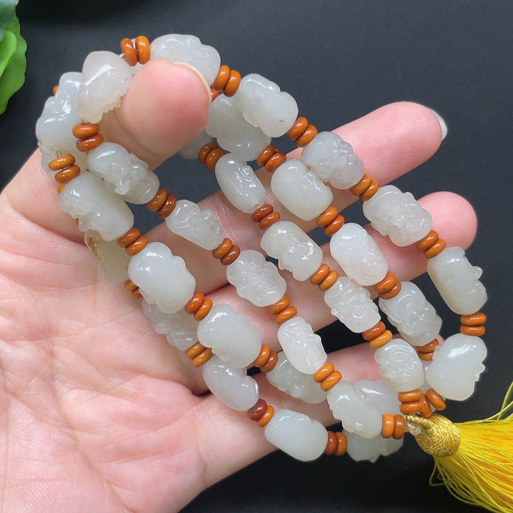 HKHQ Hetian Jade Eighteen Arhats bracelet with beaded design and string, weight approx. 65.71g, beads not genuine Hetian Jade.