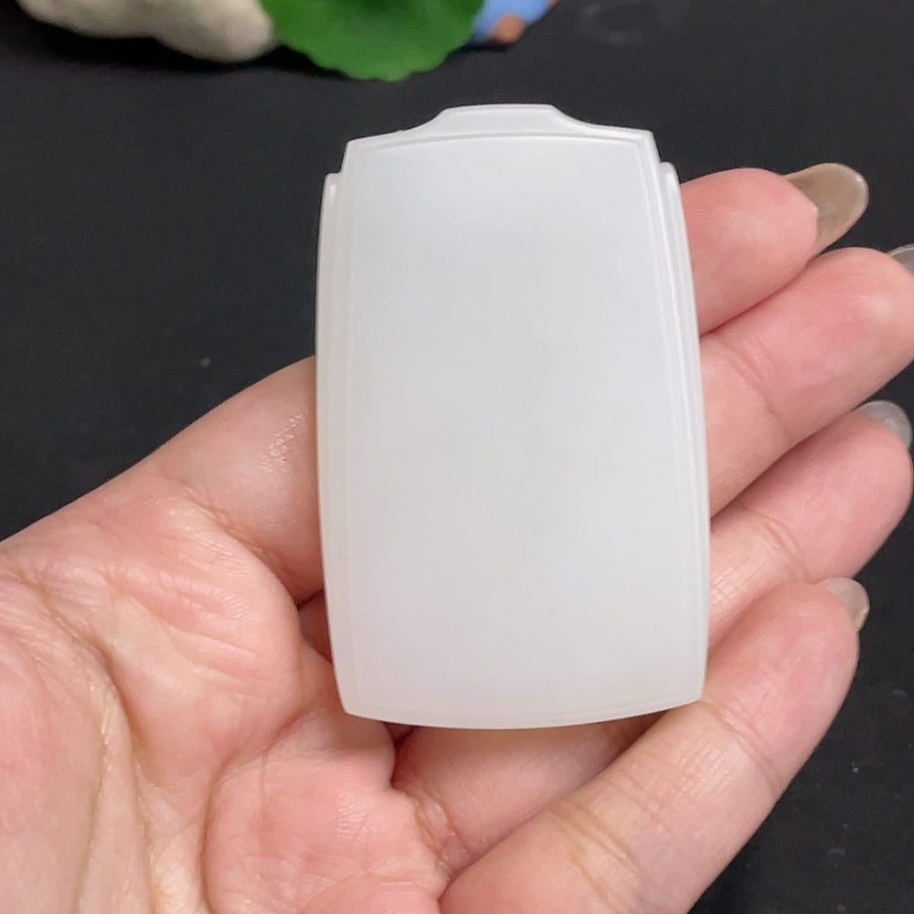Huiliu certified Hetian jade pendant, plain design, smooth polished surface, showcasing natural green jade color.