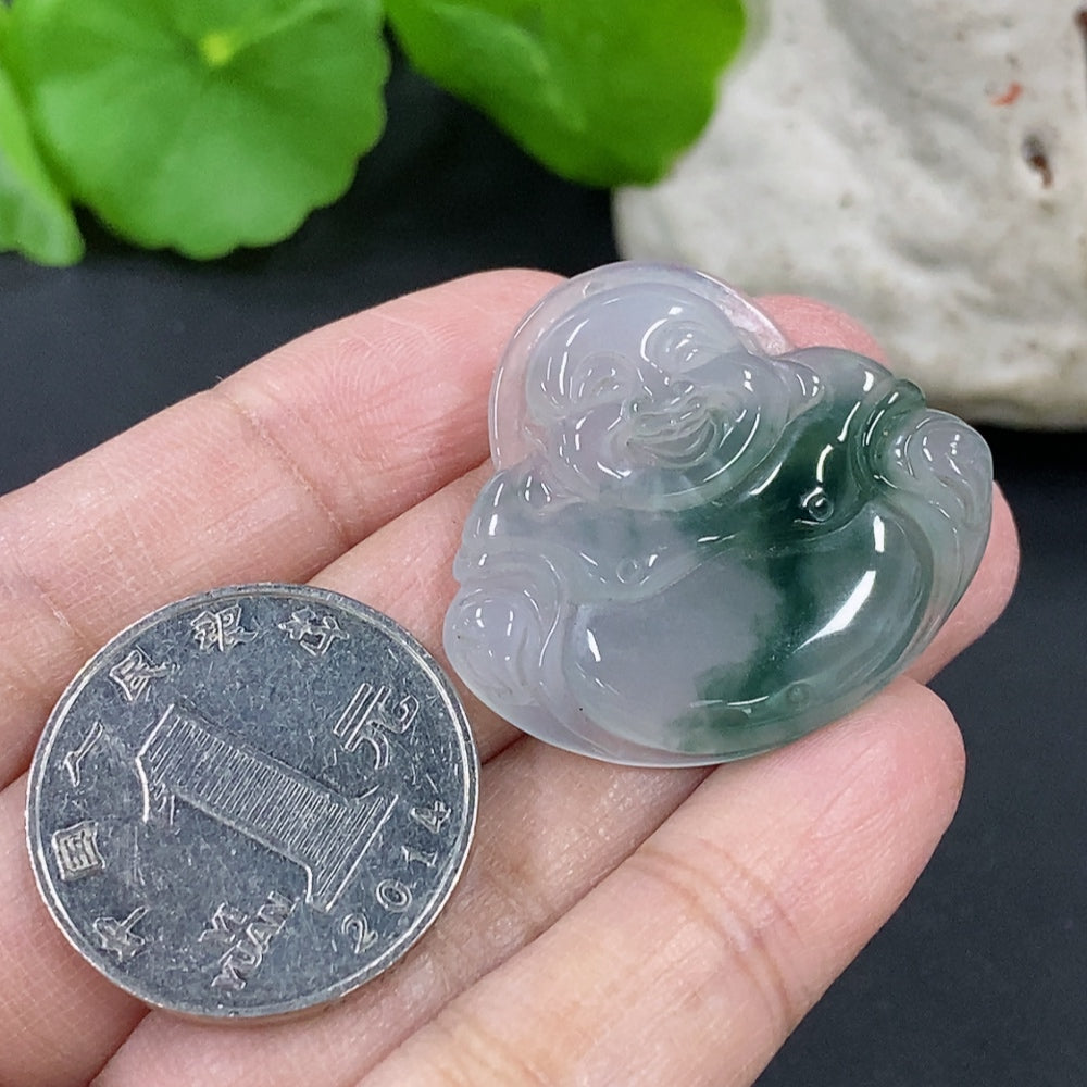 Jadeite Buddha pendant from HKHQ featuring a carved jade Buddha figure on a cord necklace.