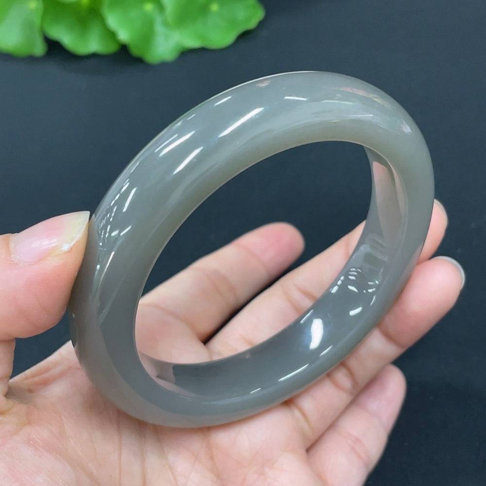 Huiliu Certified Hetian Jade round bracelet featuring smooth, polished jade beads with natural green and cream tones.