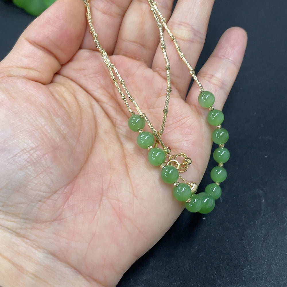 Hetian jade jasper bead necklace with 18k gold accents, 5.9mm beads, marked in red, total weight 6.1g, by HKHQ.