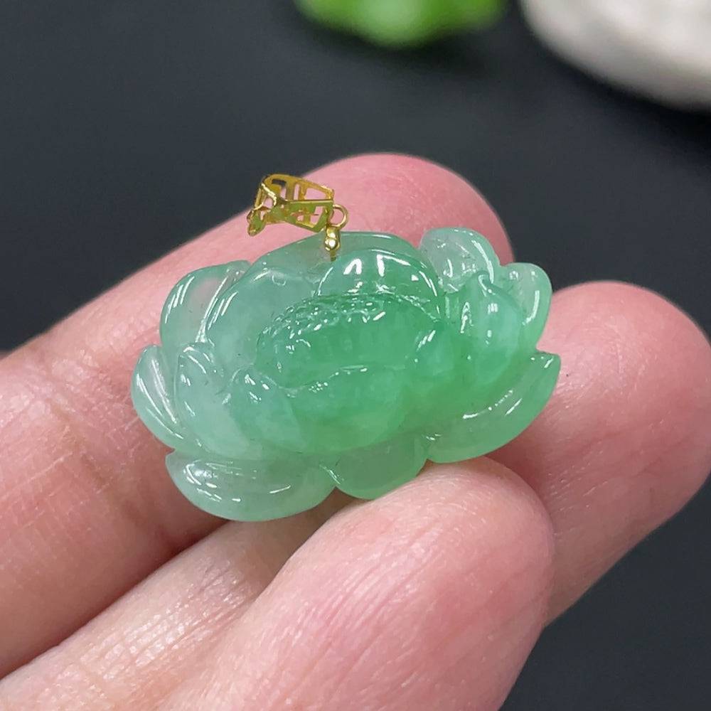 Jadeite lotus pendant with 18k gold clasp, weighing approximately 3.38g, featuring intricate lotus design and vibrant green jade color.