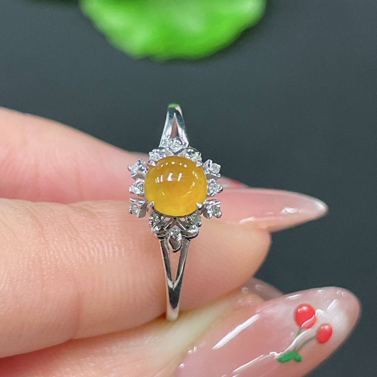 Huiliu Jadeite ring set with diamonds, featuring polished green jade rings and sparkling diamond accents, on a neutral background.