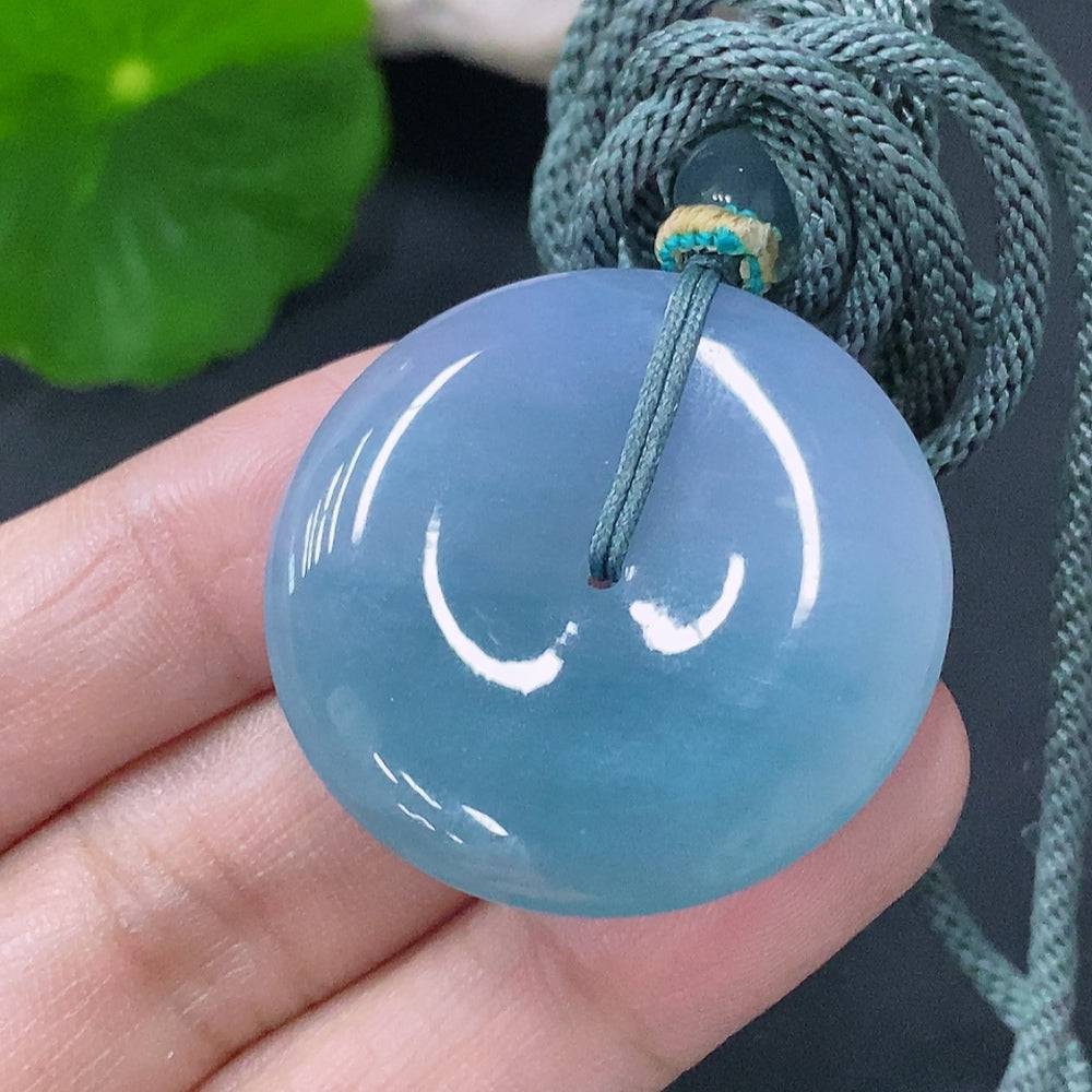 HUILIU HQ jadeite pendant with peace knot design, weighing approximately 15.2g, featuring a jade stone and attached rope.