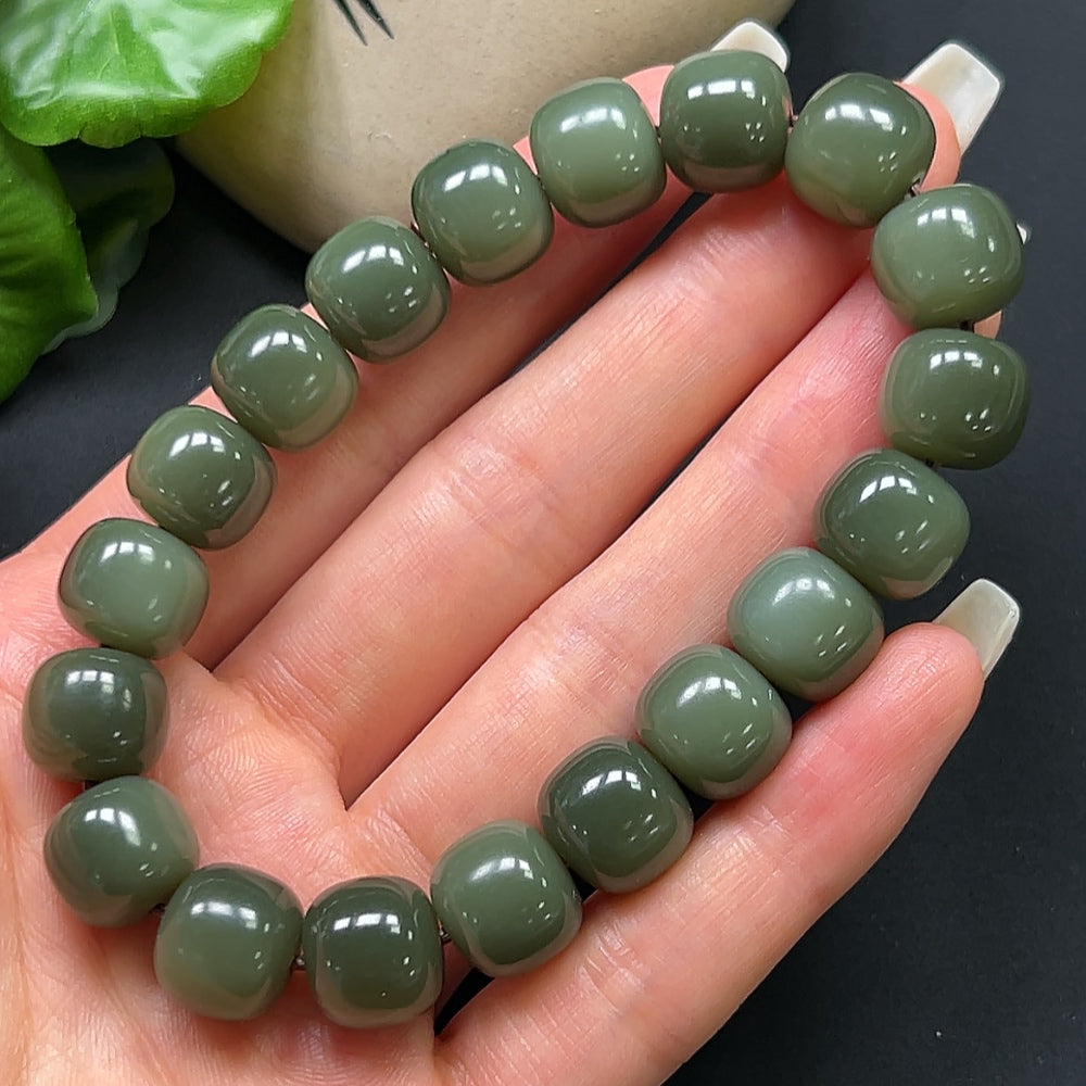 HKHQ Hetian Jade bracelet with 12mm smooth, polished jade beads, elegant and natural jewelry accessory.