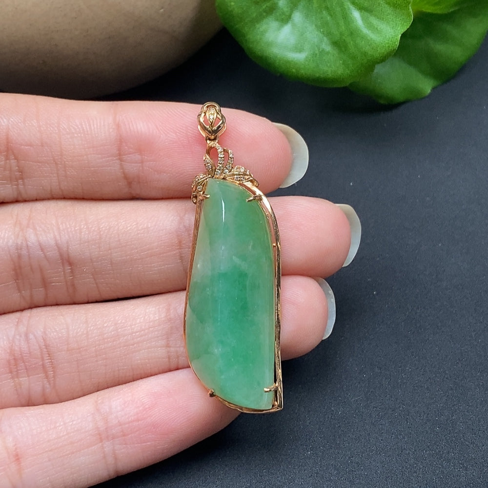 Jadeite inlaid pendant with diamond accents on an 18K necklace, showcasing intricate jewelry craftsmanship and elegant design.