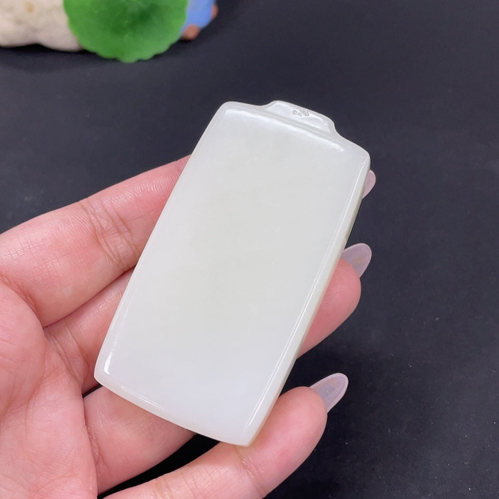 Huiliu Certified Hetian Jade Pendant featuring a plain, smooth jade stone with a polished finish on a string or chain.
