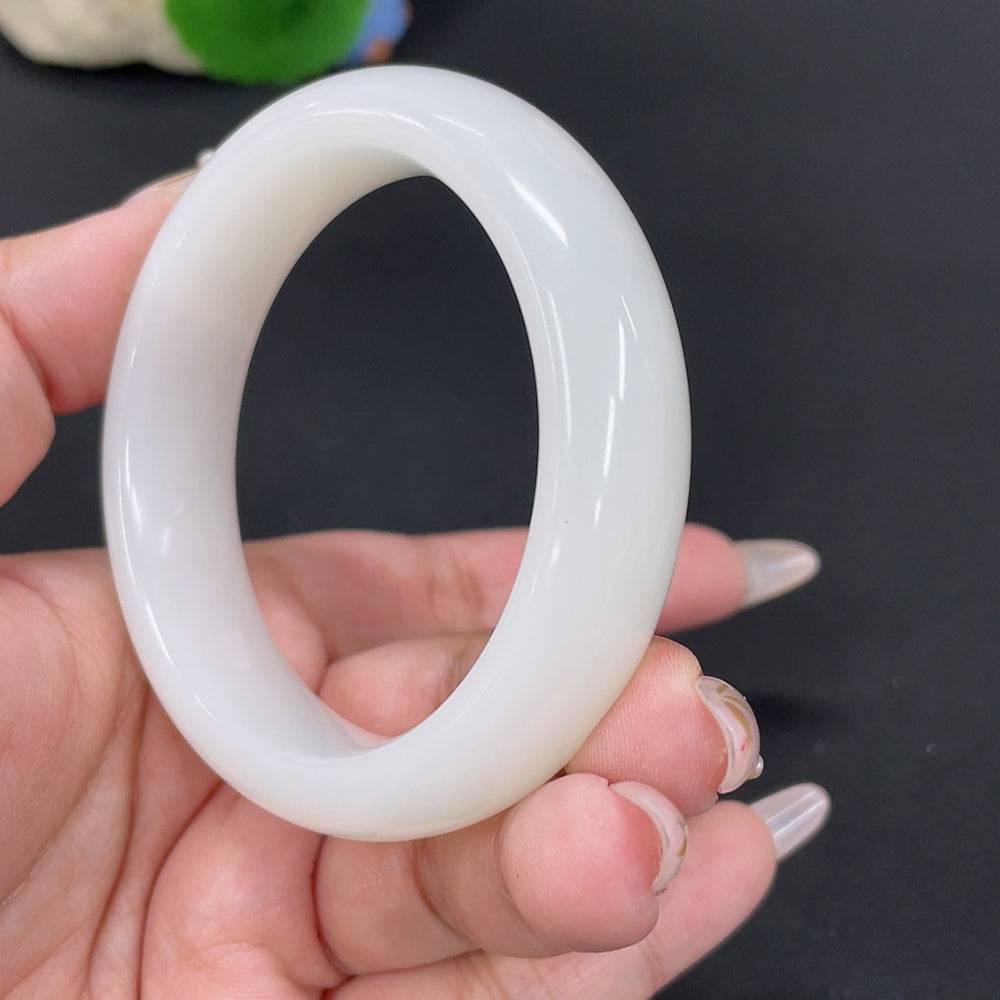 Huiliu Certified Hetian Jade round bracelet featuring smooth, polished jade beads on a delicate string.