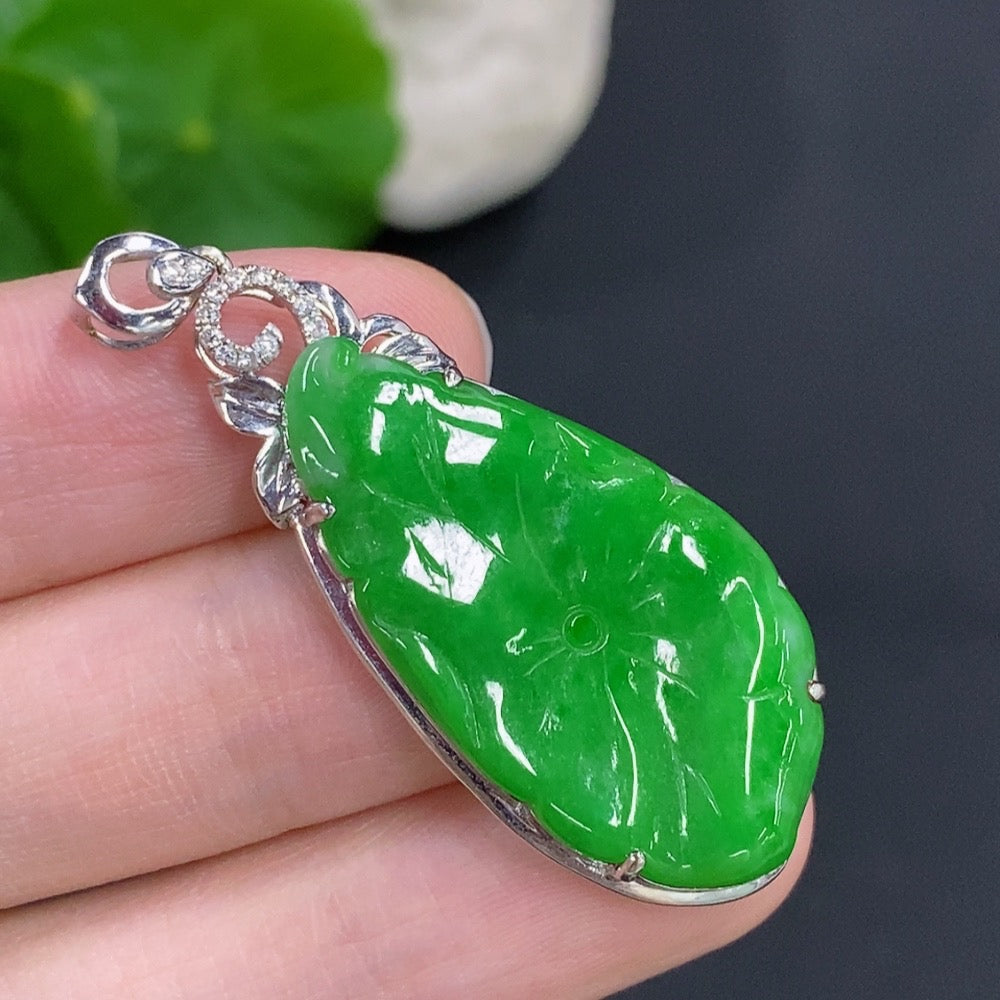 Jadeite lotus leaf pendant with 18K gold accents and diamond details, crafted by HKHQ, showcasing intricate design and elegant craftsmanship.