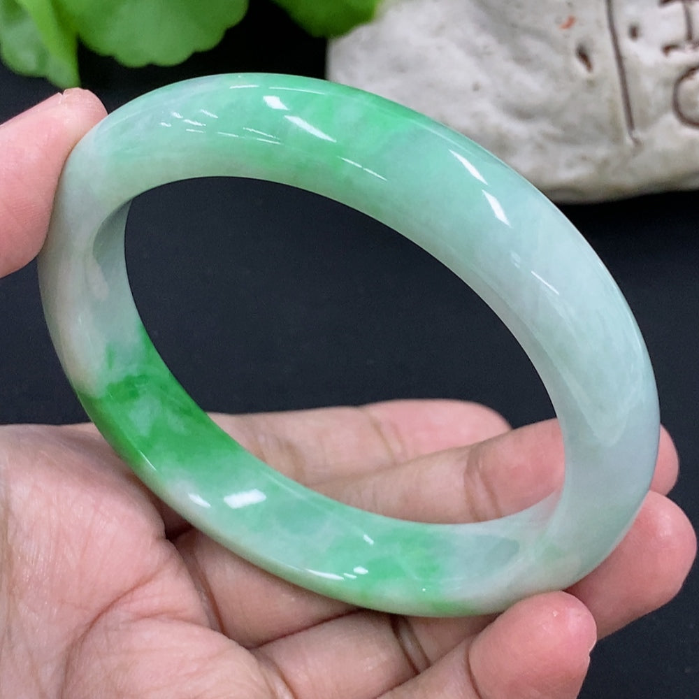Jadeite round bracelet with a weight of 54.97g and size 56.9, featuring smooth, polished green jade beads from HKHQ.
