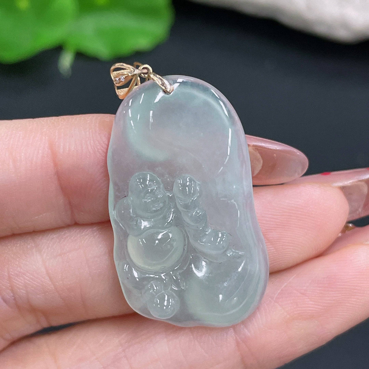 Huiliu Jadeite Buddha pendant with bezel, crafted from green jade, featuring intricate Buddha carving and polished finish.