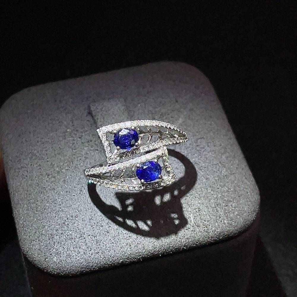 Huiliu sapphire ring with diamond accents, showcasing a vibrant blue gemstone and sparkling diamond details in a fine jewelry setting.