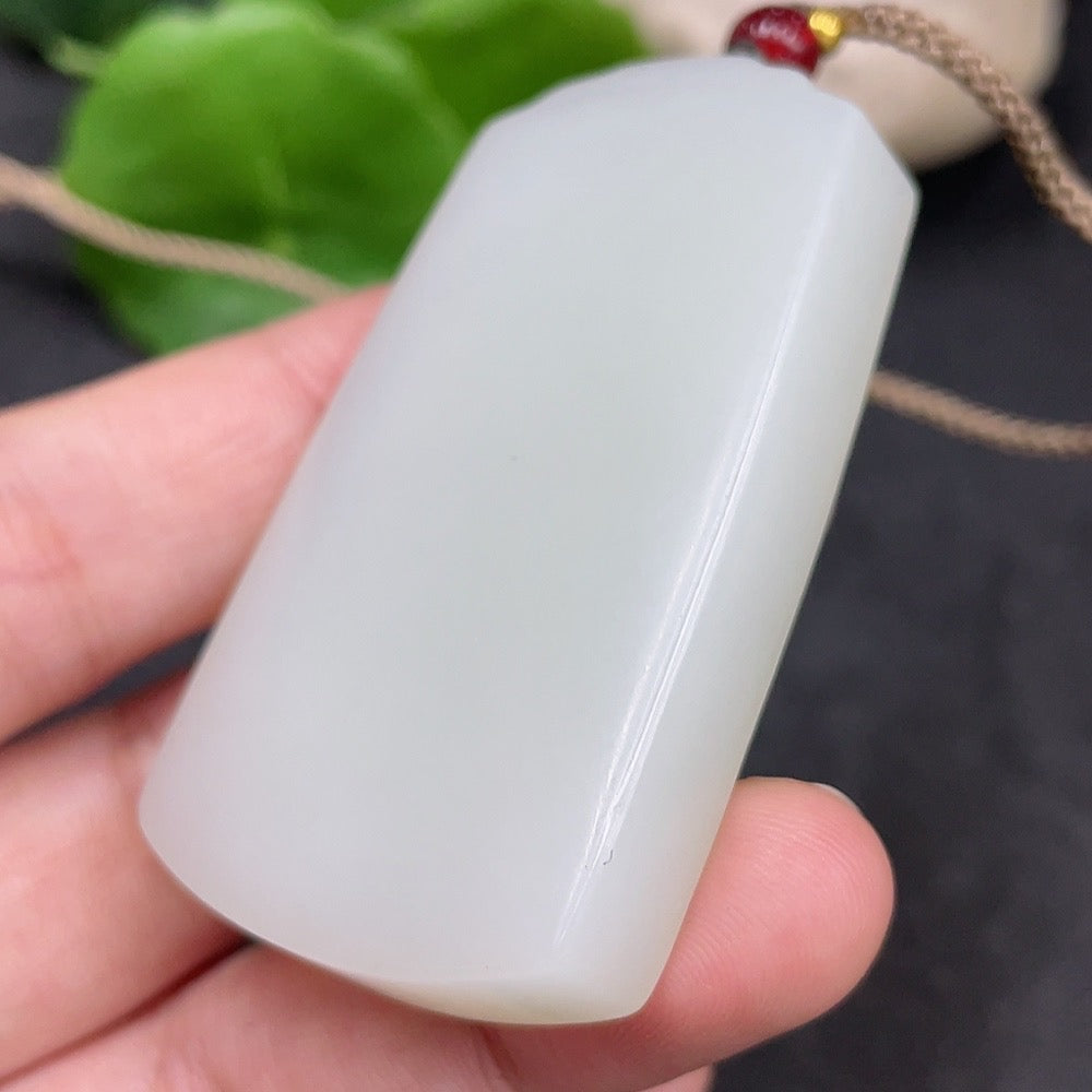 Huiliu certified Hetian jade pendant, plain smooth jade jewelry with a polished finish, showcasing elegant natural green coloration.