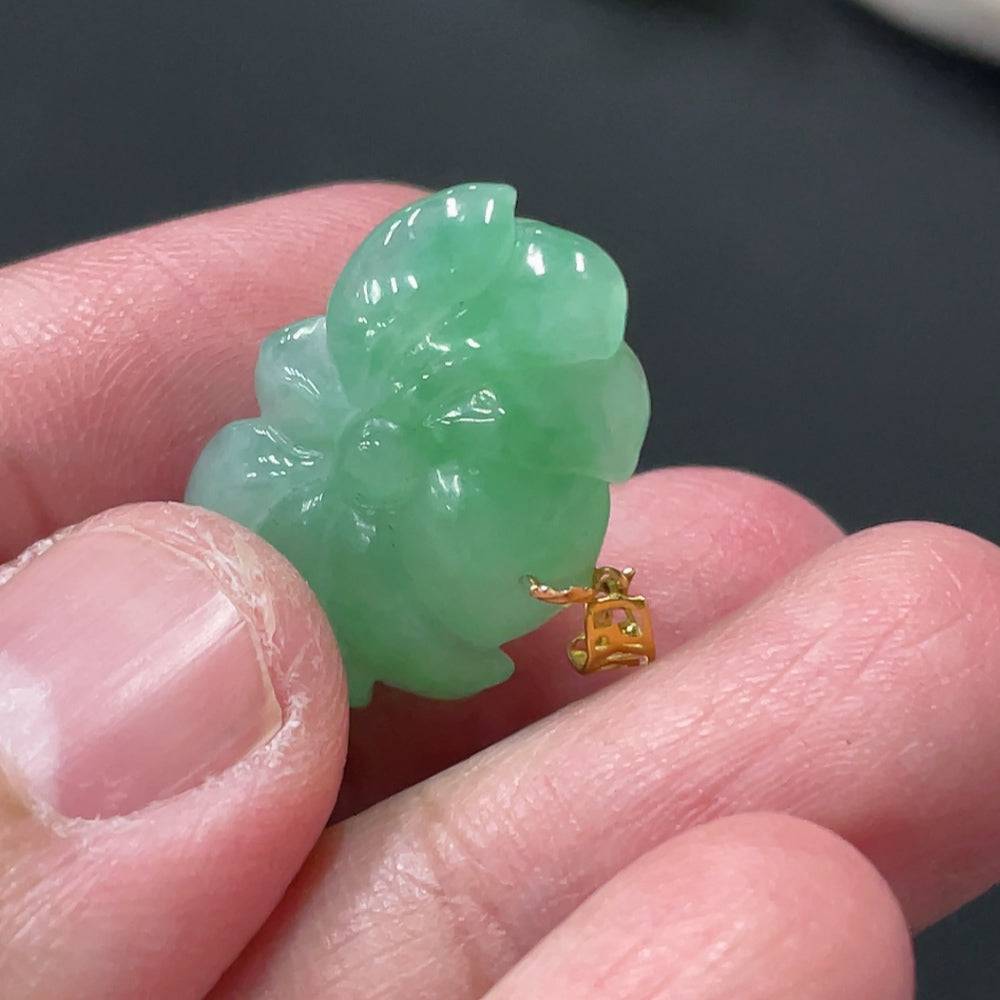 Jadeite lotus pendant with 18k gold clasp, weighing approximately 3.38g, featuring intricate lotus design and vibrant green jade.