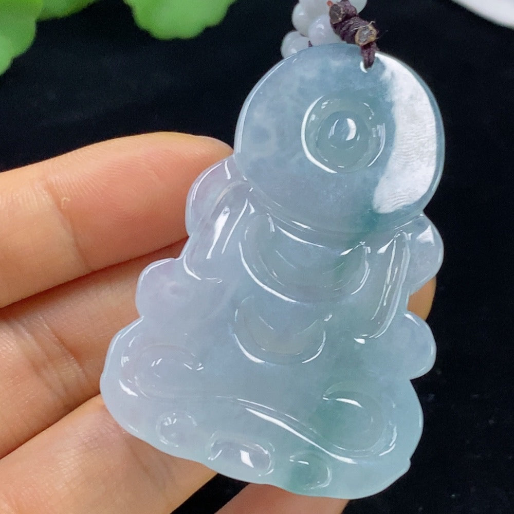 Huiliu Jadeite Tara Pendant featuring vibrant green jade, intricately carved with detailed religious design, on a delicate cord.