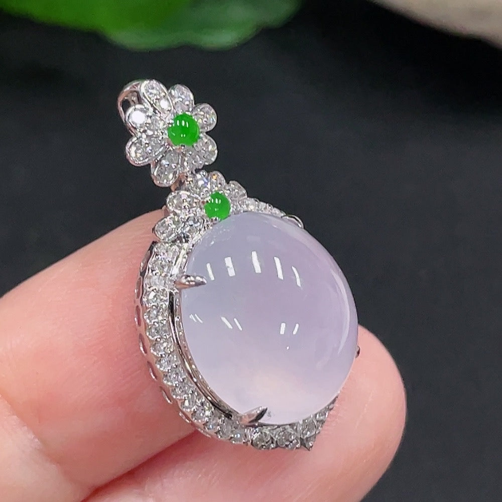 Jadeite pendant with 18K gold setting, accented with diamonds, showcasing a polished jade stone on a delicate chain.