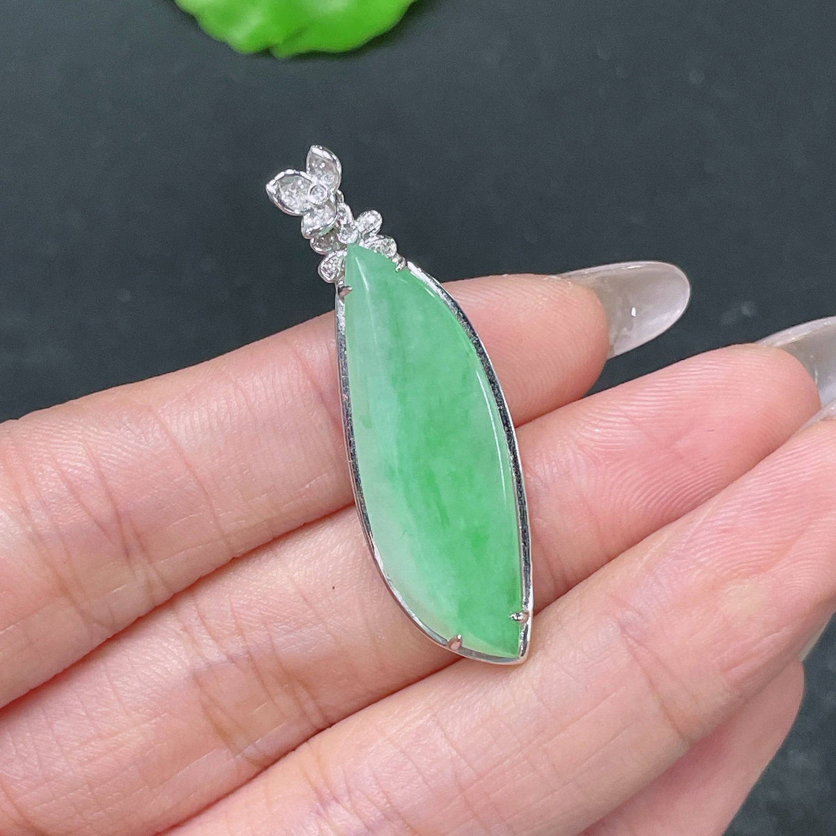 HUILIU HQ jadeite pendant Fu Gua set with sparkling diamonds, featuring a polished jade jadeite pendant on a string with diamond accents.