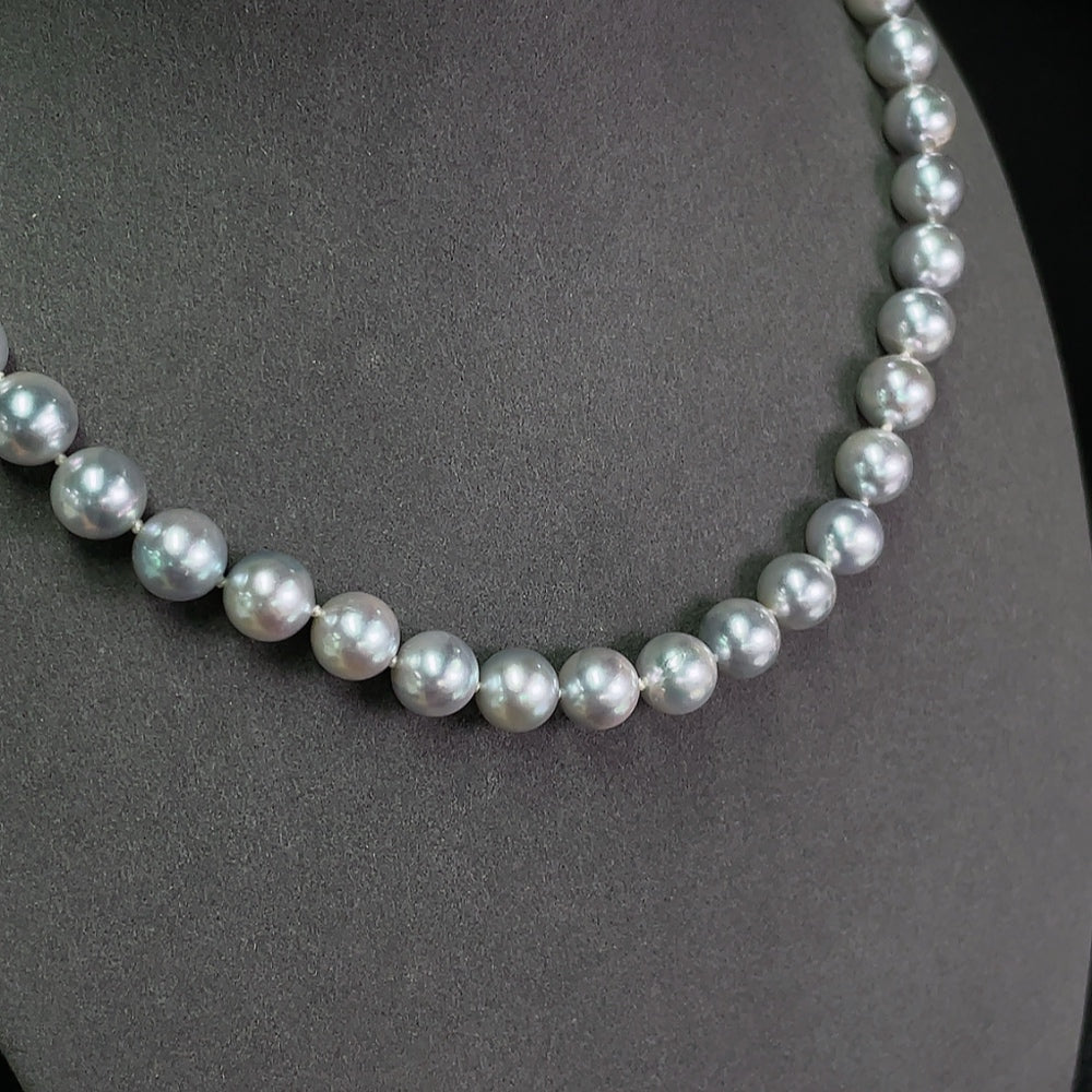 Saltwater pearl strand necklace by HKHQ featuring elegant white pearls on a non-gold string.