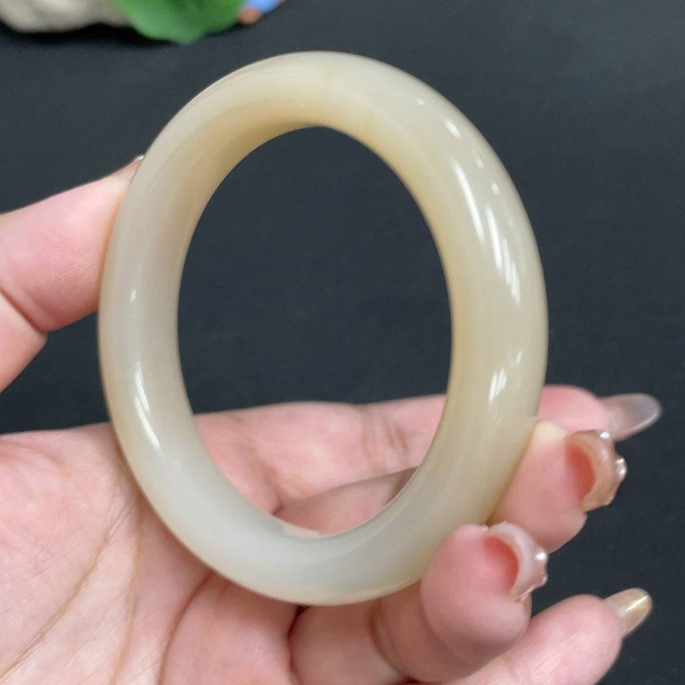 Huiliu HQ Hetian Jade round bracelet with digital certificate, showcasing smooth jade beads and intricate craftsmanship.