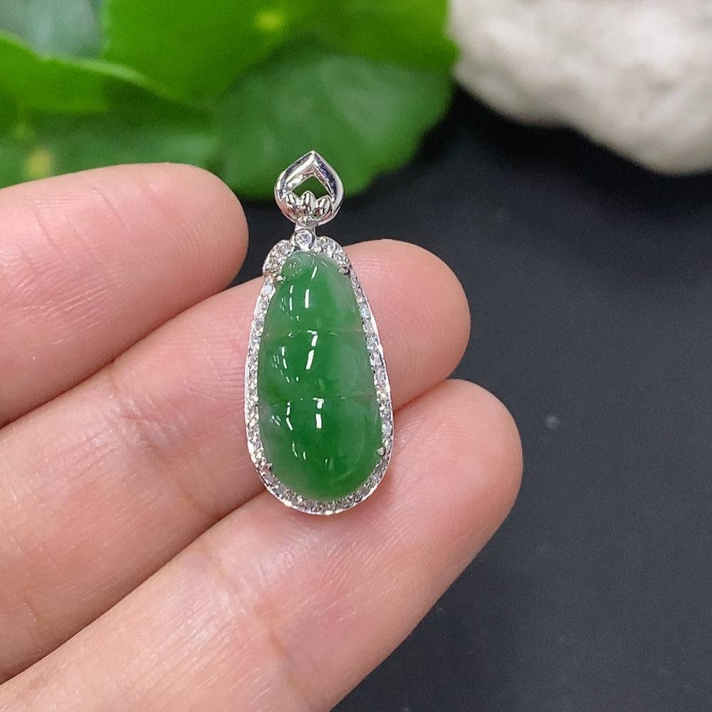 Jadeite lucky bean pendant in 18K gold with diamond accents, HUILIU HQ, featuring a polished jade stone and intricate gold setting.