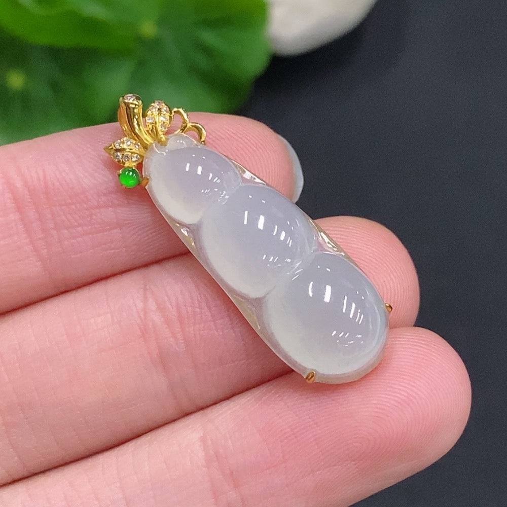 Huiliu Jadeite Lucky Bean Pendant with diamond accents, showcasing a polished green jade jadeite gemstone on a string.