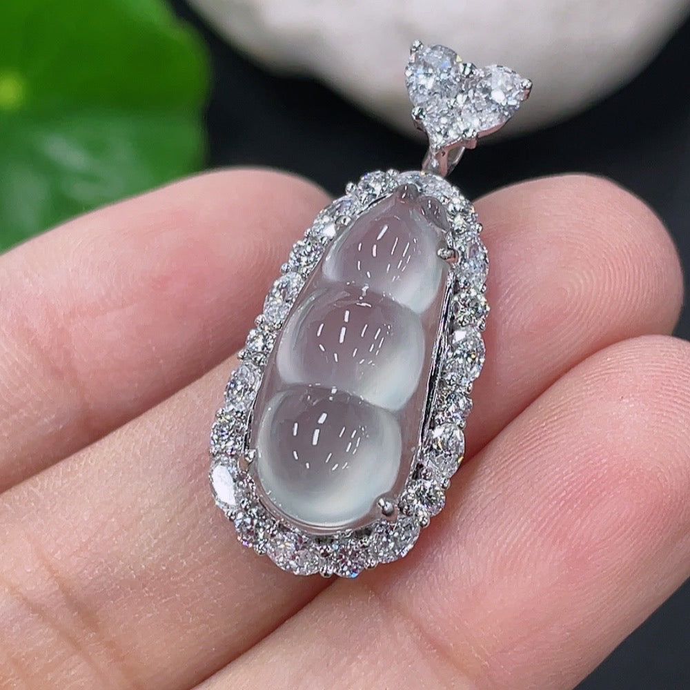 Jadeite inlaid lucky bean pendant with 18k gold, featuring intricate jade design, by HUILIU HQ, weighing approximately 3.87g.
