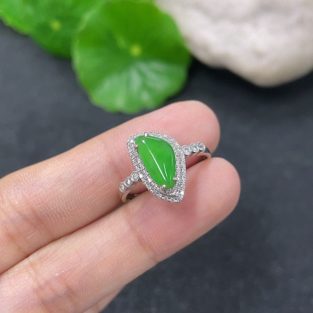 Jadeite ring with 18K gold band and diamond accents, size 13, displayed on a neutral background.