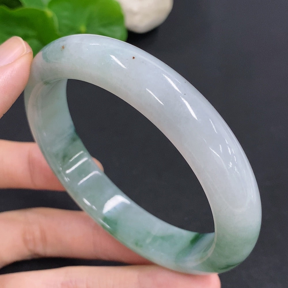 Jadeite round bangle by HKHQ, 65.6g weight, size 60, smooth green jade jewelry on a plain background.