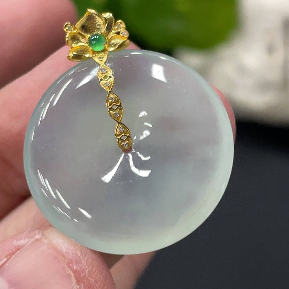 Jadeite safety pendant with 18K gold bail and diamond accents, weighing approximately 6.87 grams, from HUILIU HQ.