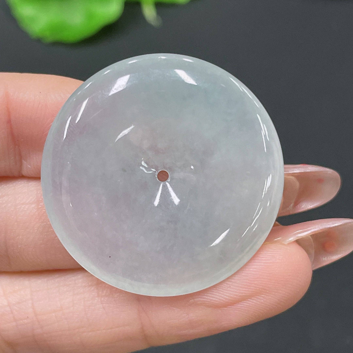 Jadeite pendant featuring a Peace Knot design, crafted by HUILIU HQ, weighing about 11.4g, with intricate jade craftsmanship.