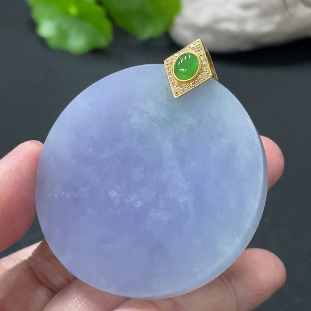 Jadeite plain pendant with 18K gold clasp and diamond accents, showcasing smooth, polished jade in a close-up view.