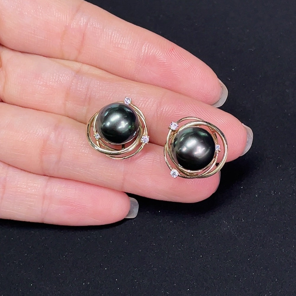 Saltwater pearl stud earrings in 14K gold by HKHQ featuring elegant, lustrous pearls on classic earring studs.