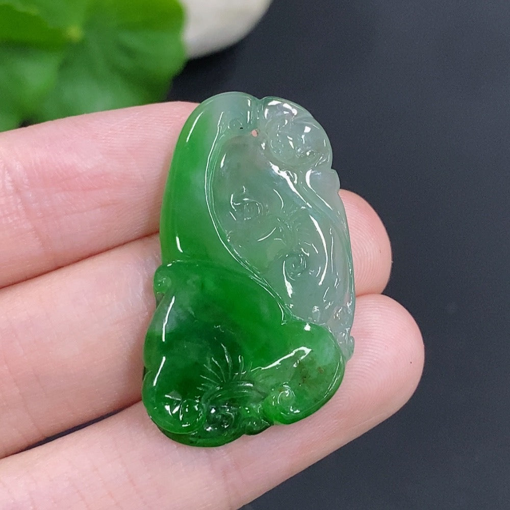 Jadeite Ruyi pendant from HKHQ, crafted from green jade with intricate design, weighing approximately 5.5 grams.