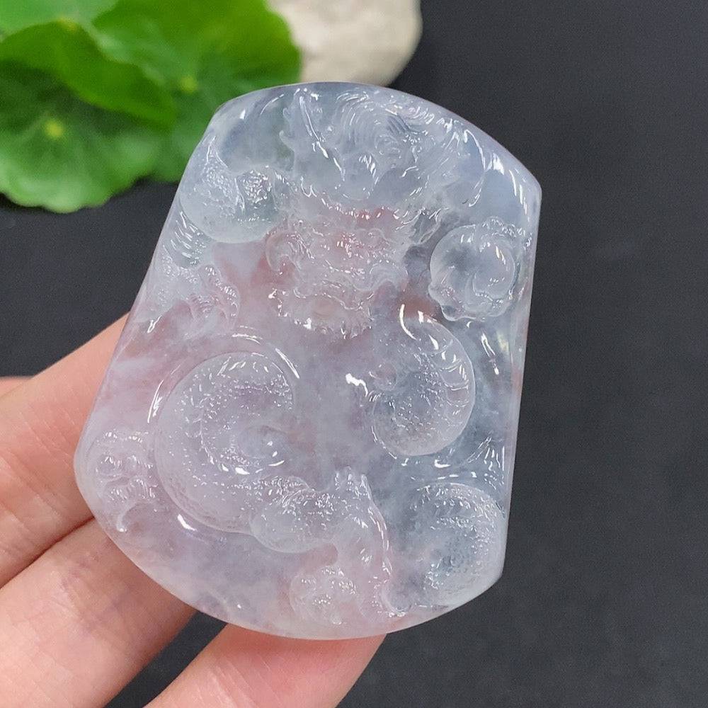 Jadeite dragon pendant by HUILIU HQ featuring a soaring dragon design across a jade pendant.