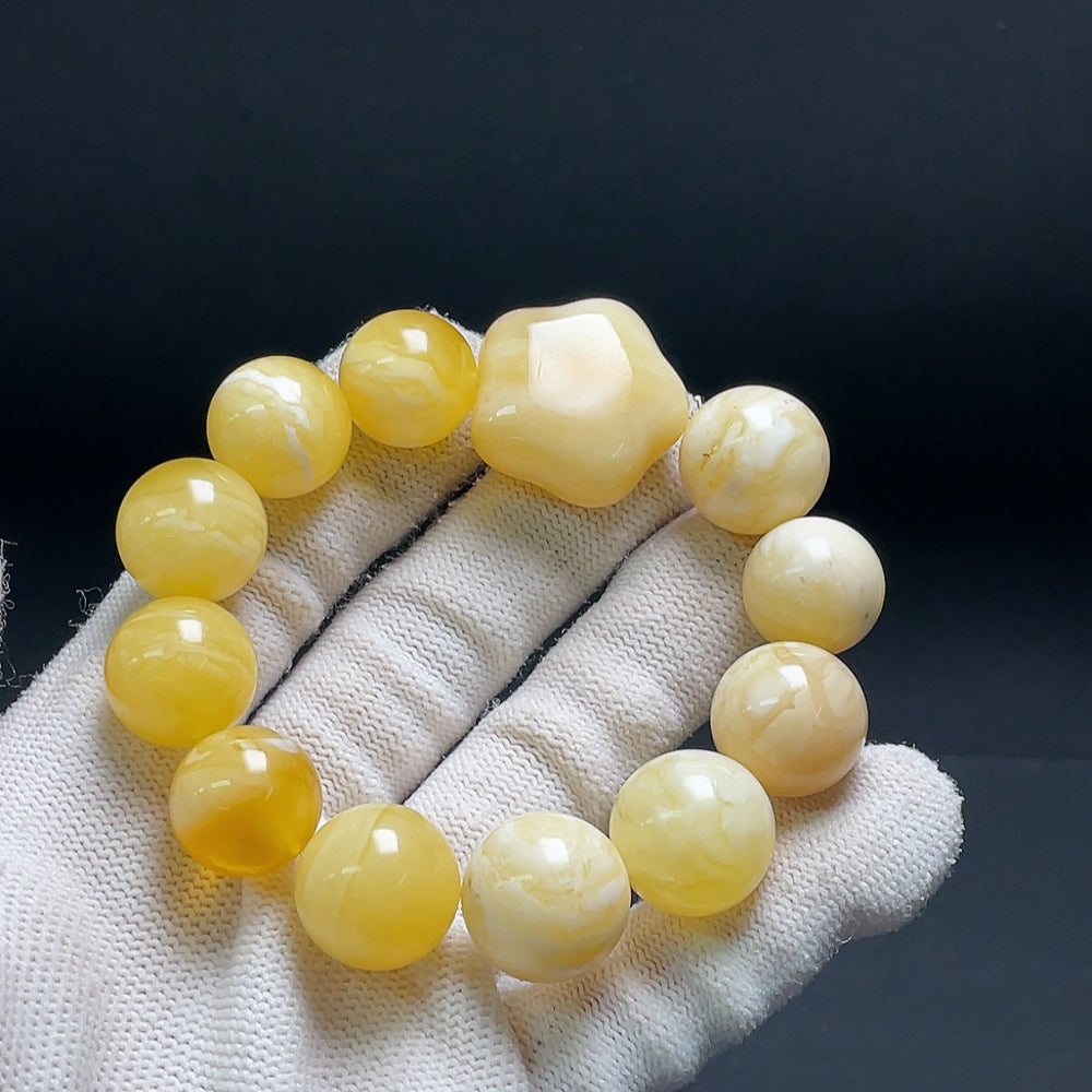 Huiliu Amber Beeswax bracelet with 15.1mm beads, natural amber color, and certified quality, displayed on a neutral background.