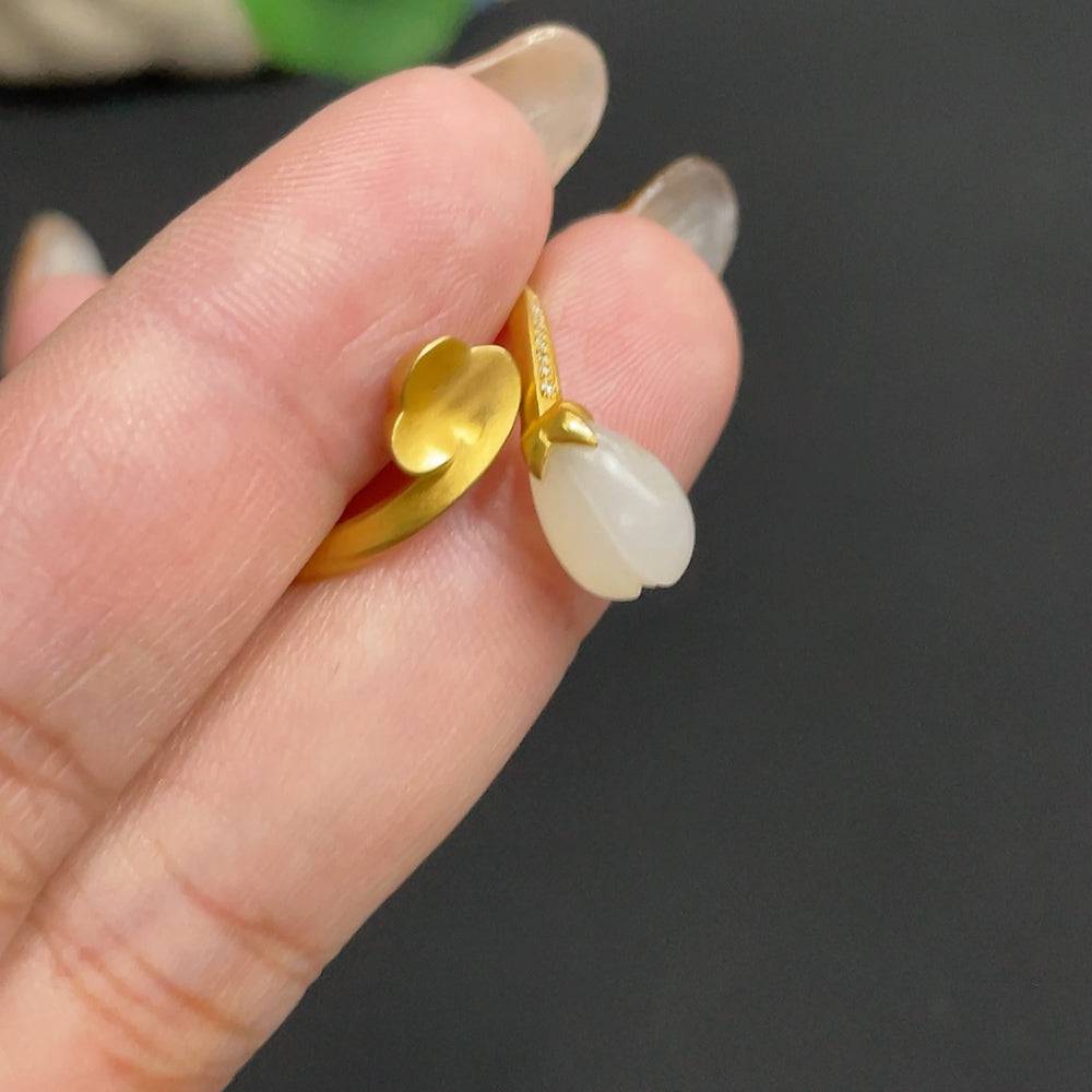 Huiliu Hetian Jade Magnolia Inlay Ring with diamond accents, showcasing green jade and elegant design on undetermined skin tone.