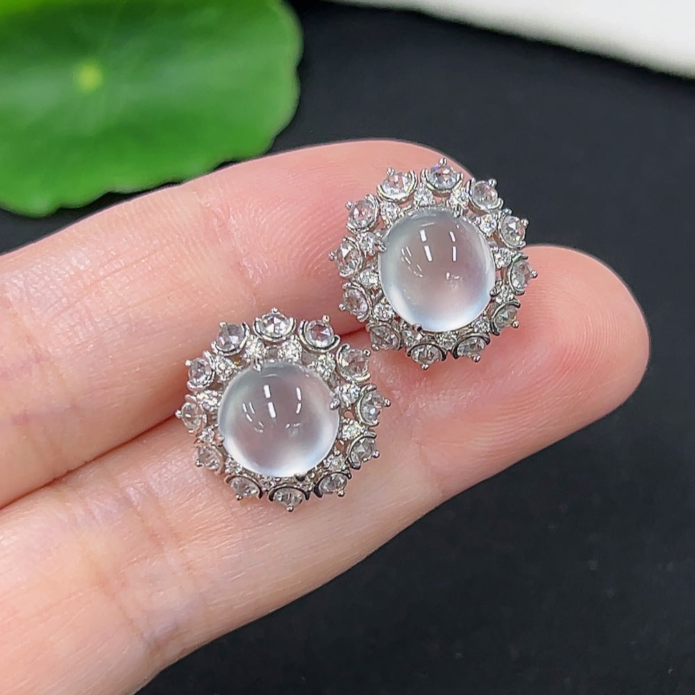 Unmarked jadeite earrings with 18k gold and diamond accents, weighing approximately 4.9g, featuring elegant gemstone details.