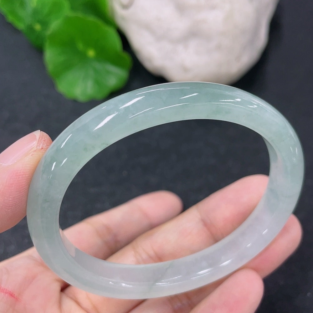 HKHQ jadeite oval bangle in size 52.8 with a 27.69g weight, showcasing smooth, polished jadeite craftsmanship.