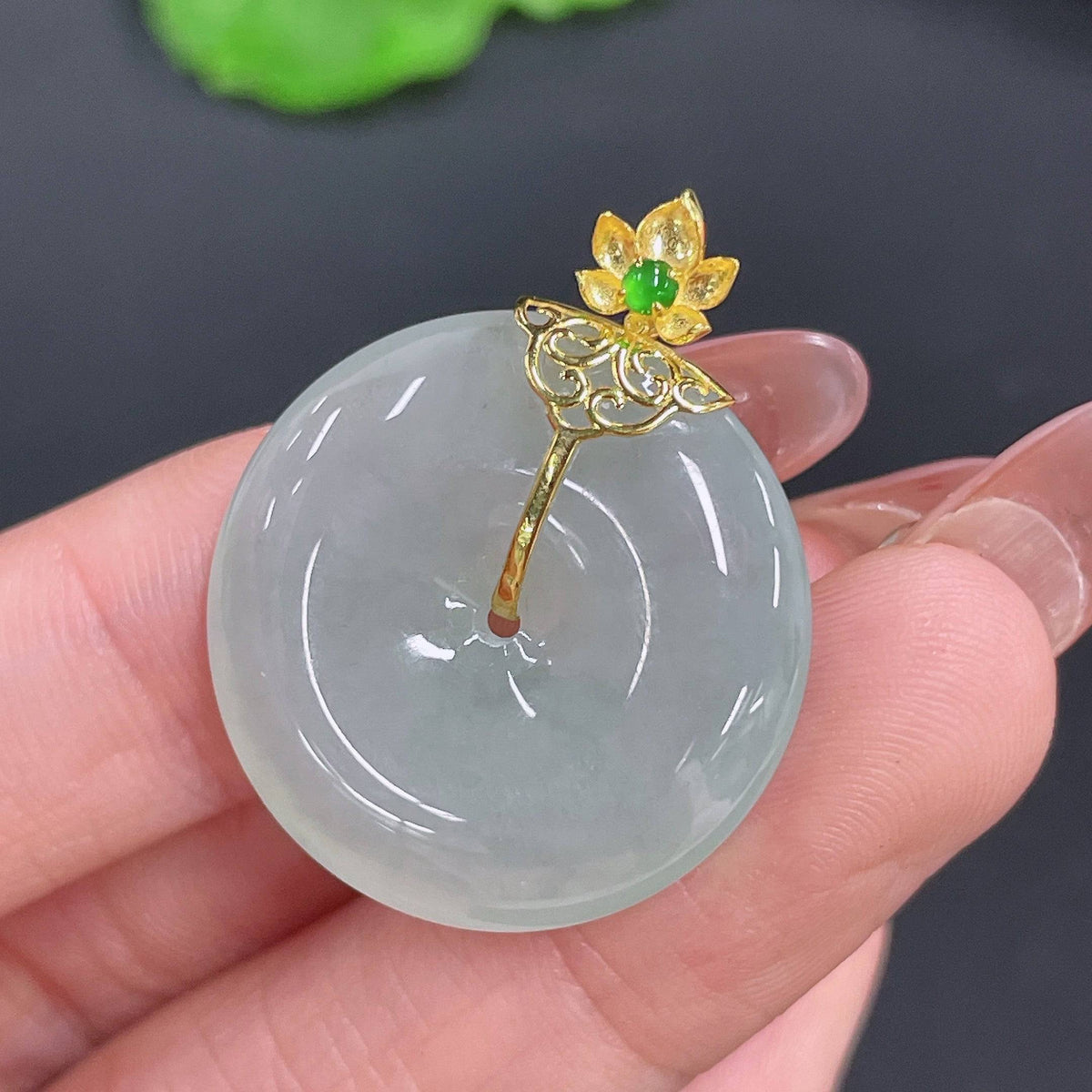Huiliu Jadeite Peace Knot Pendant featuring a carved jade pendant with a traditional peace knot design.