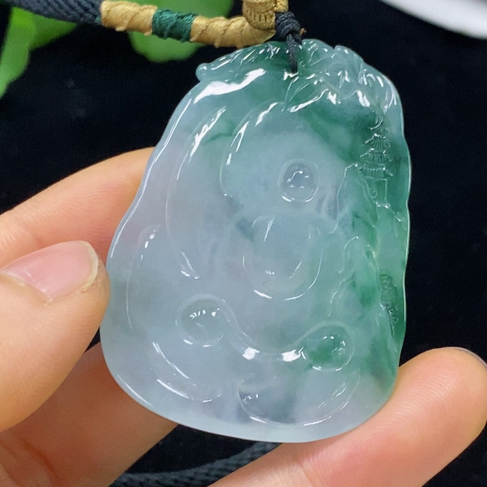 Jadeite Buddha pendant with rope, crafted from green jade, weighs approximately 26.06 grams, displayed against a neutral background.