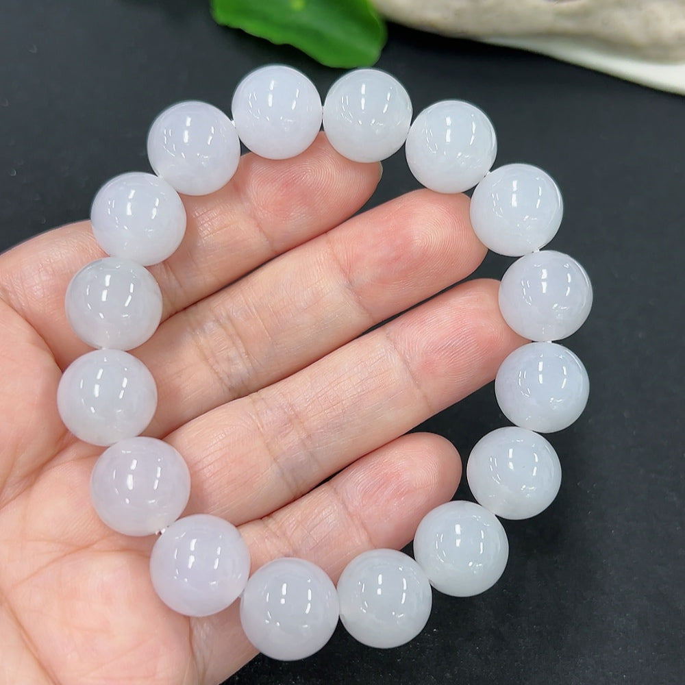 Jadeite bracelet with 12.8mm beads, weighing approximately 58.1g, featuring smooth, polished green jadeite stones from HKHQ.
