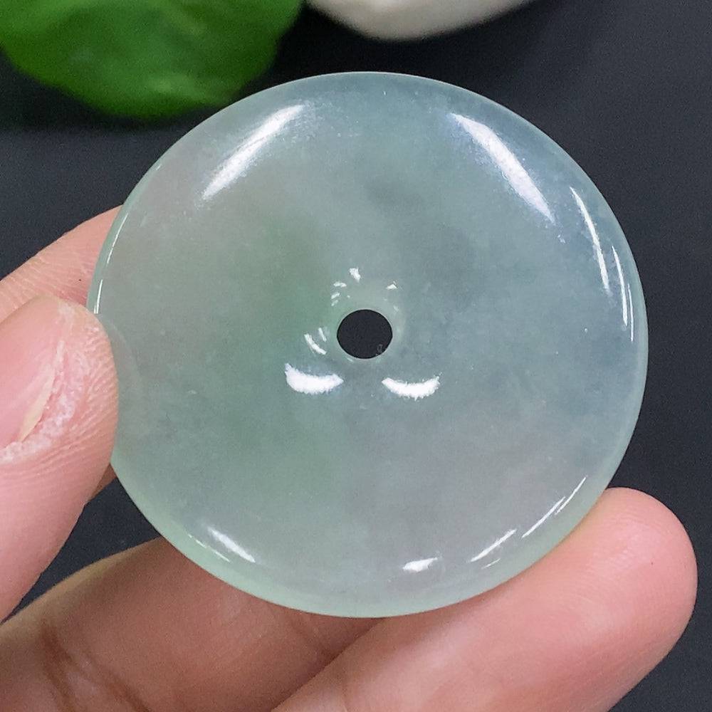 Jadeite Peace Knot pendant from HUILIU HQ, crafted in green jade with intricate knot design, weighing approximately 17.4 grams.