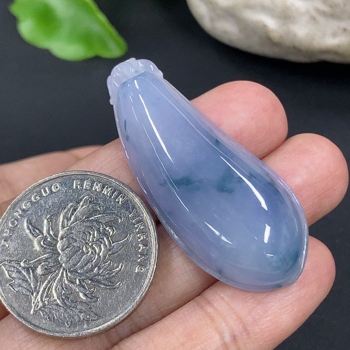 Jadeite auspicious gourd pendant from HKHQ, intricately carved in jade with a smooth polished surface, weighing approximately 10.4g.