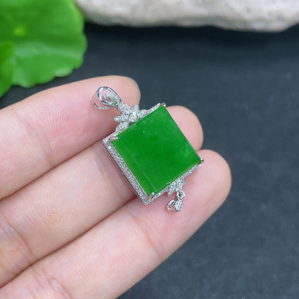 Jadeite pendant with 18k gold and diamond accents, featuring a polished green jade stone on a delicate necklace.