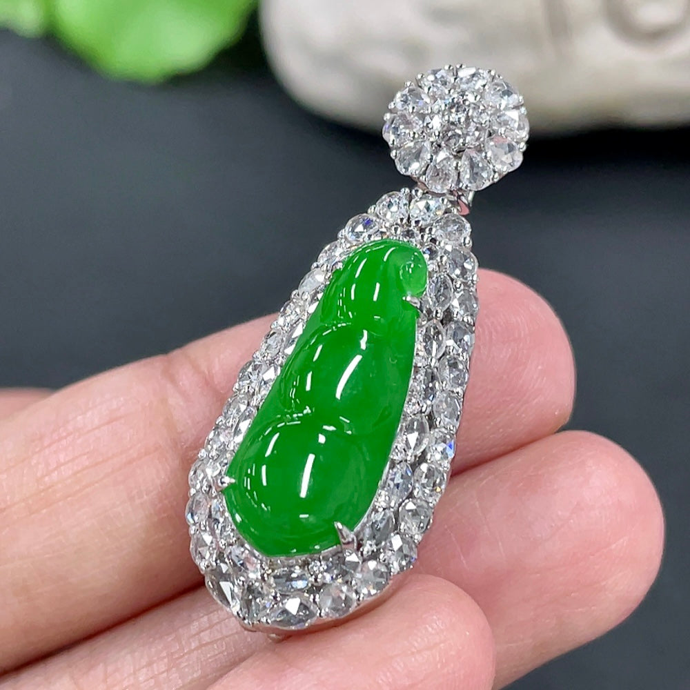 Jadeite blessed bean pendant in 18K gold with diamond accents, featuring a smooth jade gemstone, by HKHQ.
