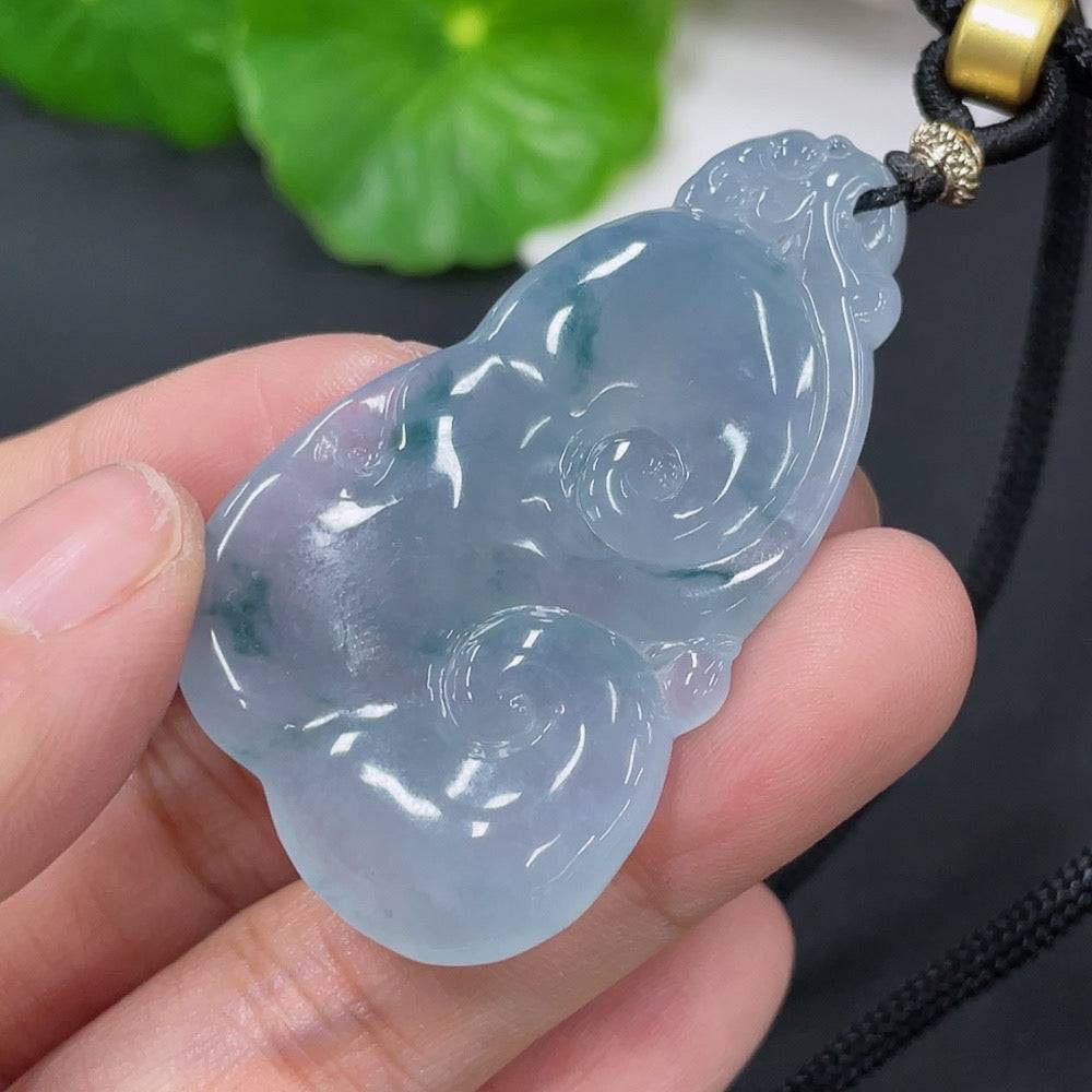 Jadeite pendant with Ruyi design from HUILIU HQ, weighing approximately 15.72g including rope, featuring smooth green jade surface.