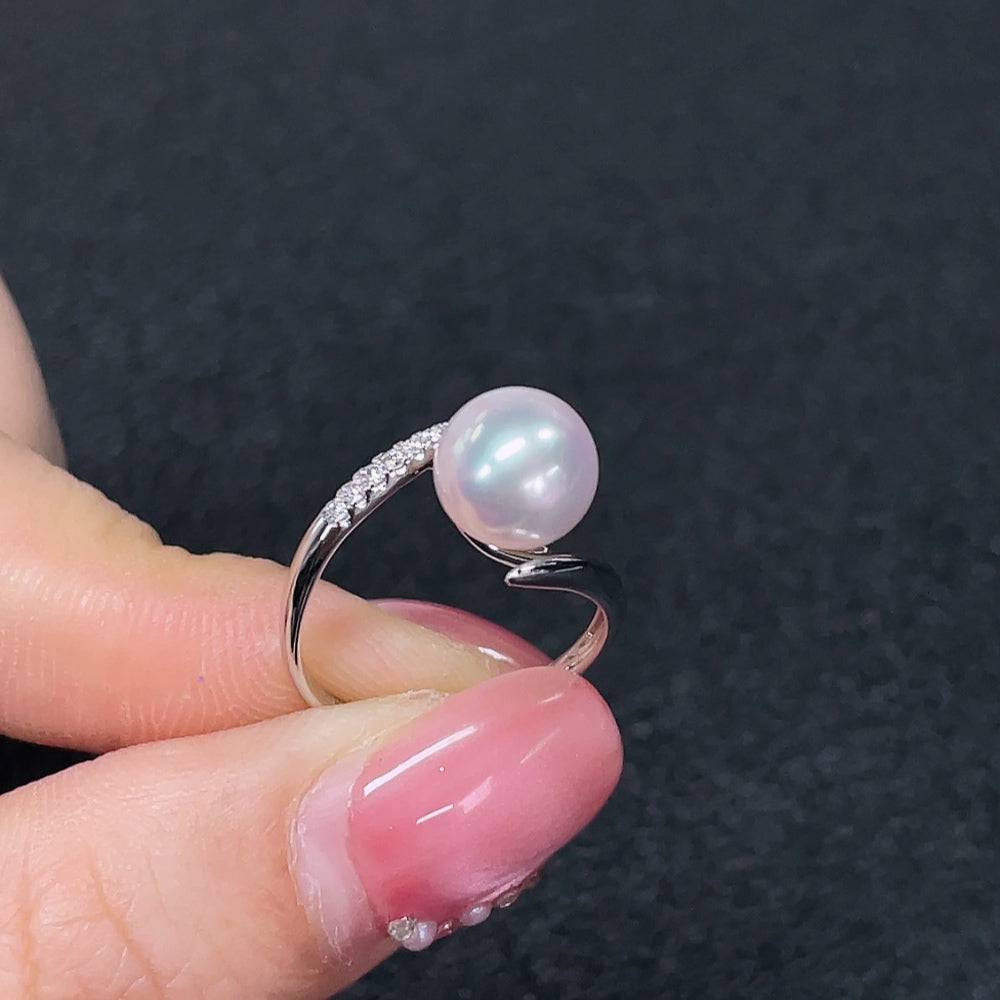 Huiliu pearl ring featuring an 8.2mm sea water pearl with undetermined color, set in a classic jewelry design.