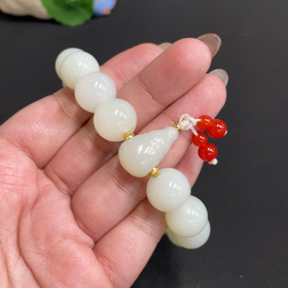 Huiliu Hetian Jade bracelet with 13.8mm beads featuring mineral components, crafted by HUILIU HQ.
