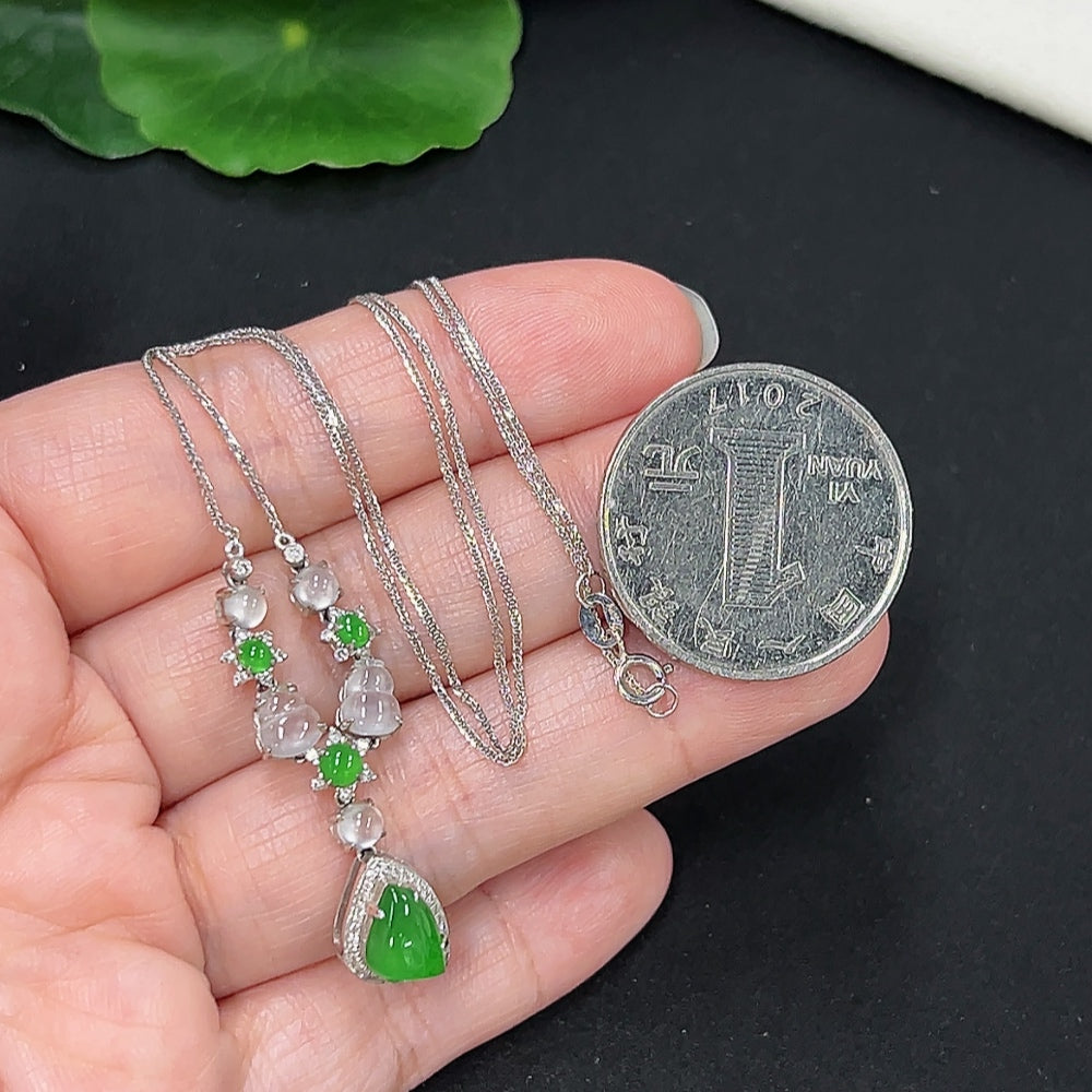 Elegant jadeite necklace with diamond accents in 18K gold, featuring a smooth, polished jade pendant, crafted by HKHQ.