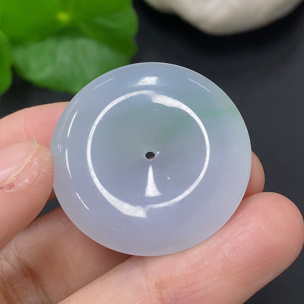 Huiliu Jadeite Peace Knot pendant with intricate design, crafted from high-quality jade, showcasing smooth green and white hues.